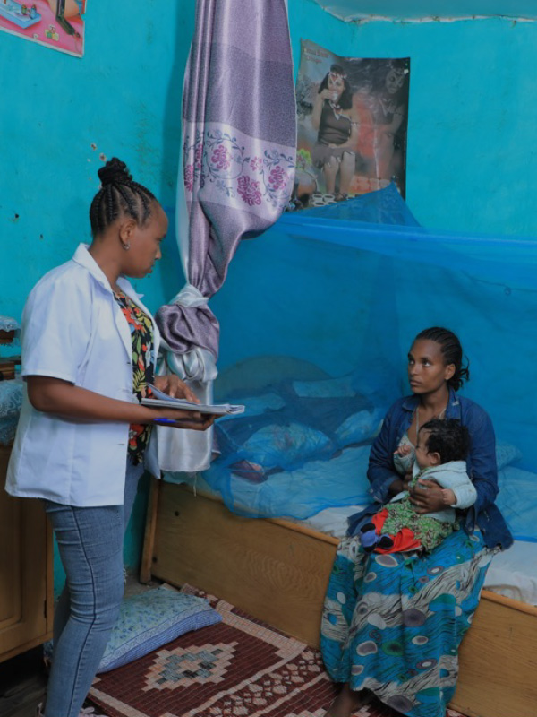 health extension worker talking with her client